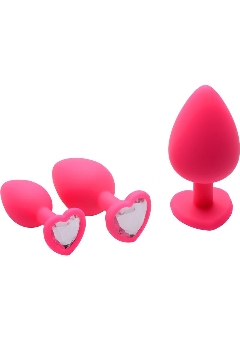 Tapones anales de silicona con forma de corazón y detalles de gemas en color rosa, 3 tamaños variados por caja